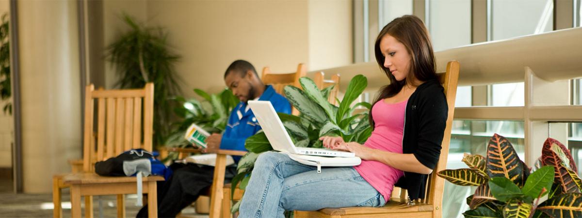 Associate of Arts Programs at Minneapolis College Two students sitting in chairs, studying
