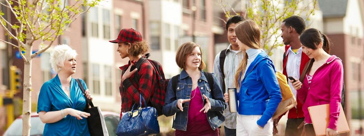 Communication Studies Program at Minneapolis College A group of students socializing while waiting for a city bus