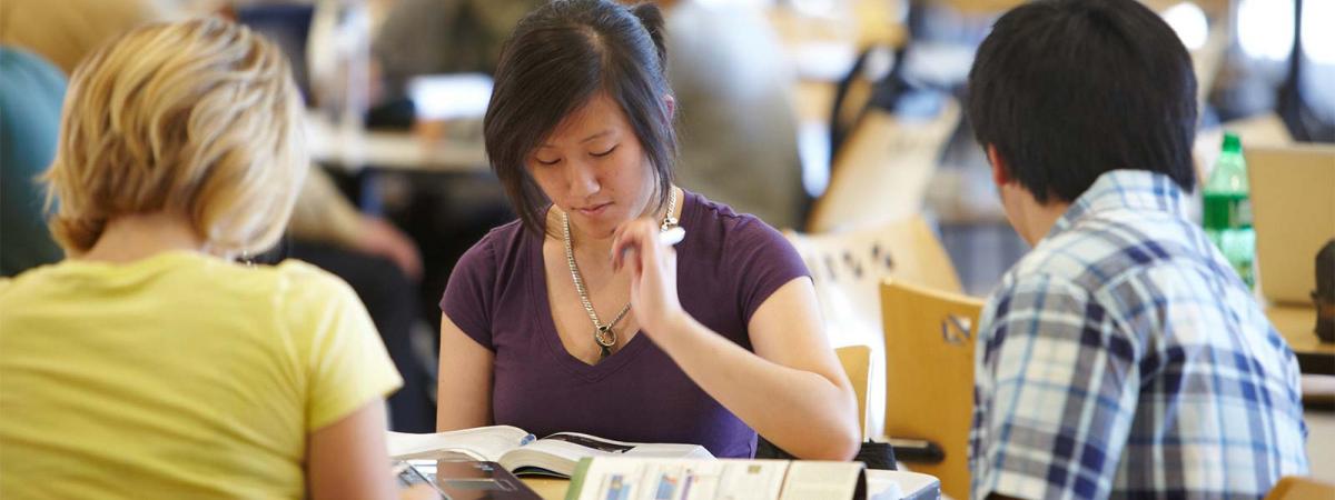 Cost and Aid at Minneapolis College Students studying at a table