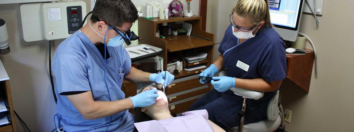 Dental Assistant Program at Minneapolis College dentist working on patient with dental assistant