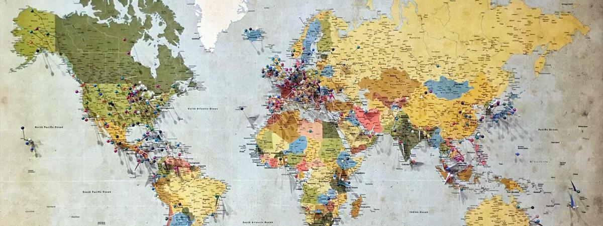 Global Studies at Minneapolis College Map of the Earth with pins pushed into areas of the map