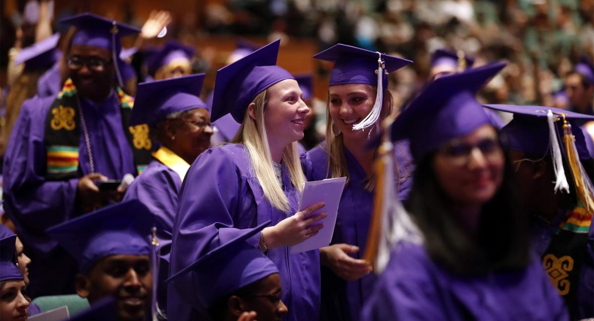 Graduates at the Minneapolis College Commencement Ceremony 2019 Grads talking during Commencement at Minneapolis College