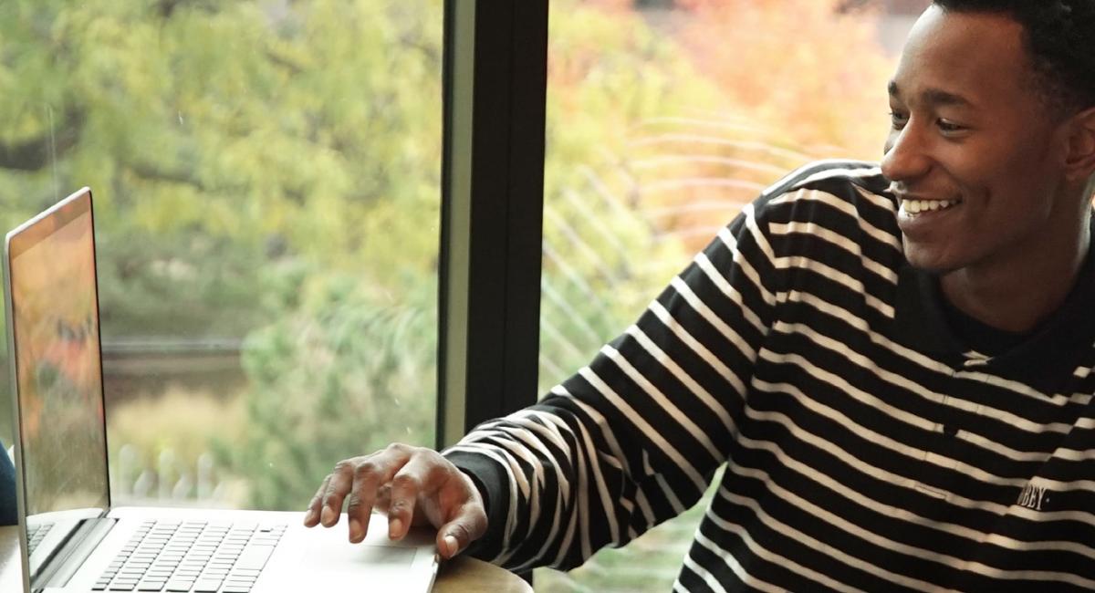 Minneapolis College man in striped shirt