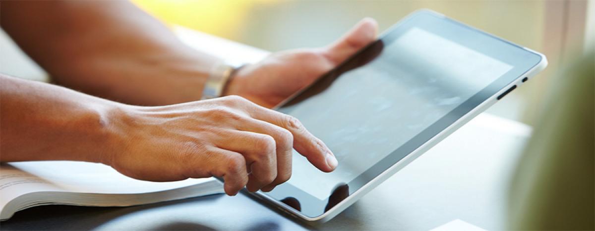 Your Next Steps hands on a tablet