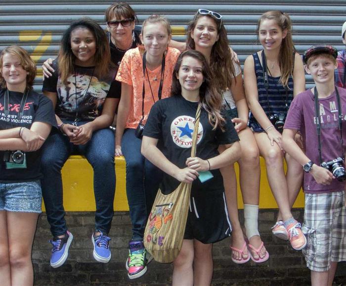 group of high school students posing with instructor