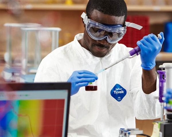 College Catalog Online for Minneapolis College Student performing experiment in the lab at Minneapolis College