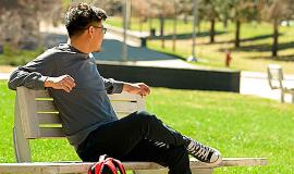 Student Scholar on a Park Bench